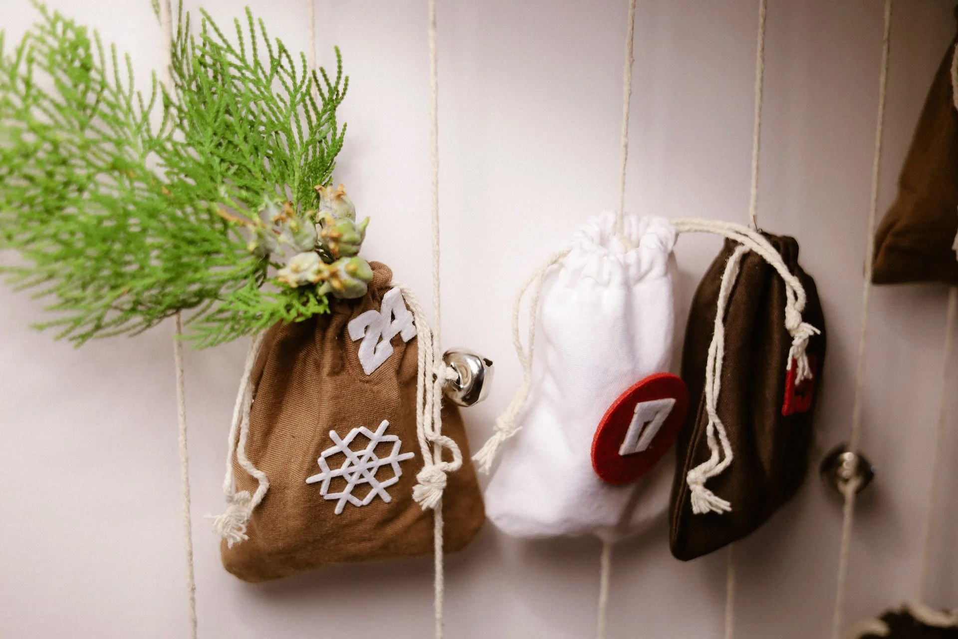 vintage christmas decor ideas 2026 — handmade advent calendar with small fabric bags